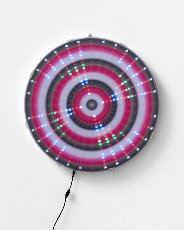 'Mandala for the Lost – Big Progress / Pathways for your Future / Pre-packaged Deals/ Happy People [Mantra reads Black / White / Pink / Black Repeat]', 2015<br/>Animated Led lightwork, digital print, Perspex vinyl gel ‘haze screen’<br/>60cm diameter