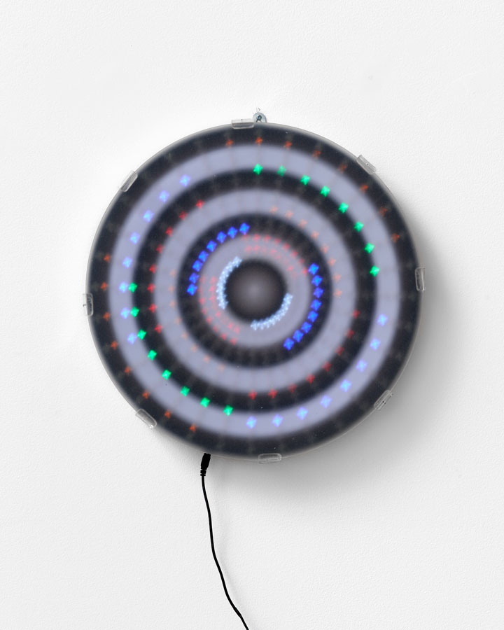 'Mandala for the Lost - Unfortunately history does repeat [Mantra reads Black White Black White repeat] education modules and colonial hangovers – we can fix it...', 2015<br/>Animated Led lightwork, digital print, Perspex vinyl gel ‘haze screen’<br/>45cm diameter
